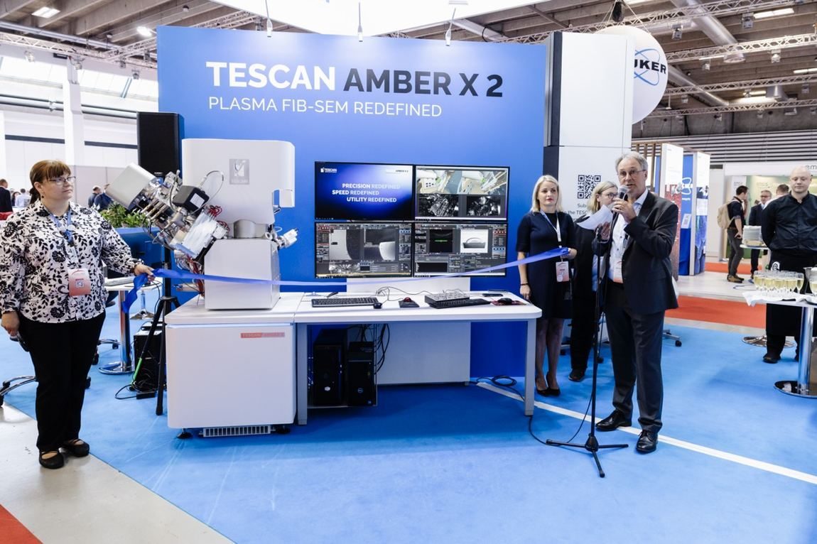 Ribbon cutting for a product launch on the show floor